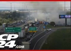 Large fire and plumes of smoke stalls traffic on northbound Highway 400